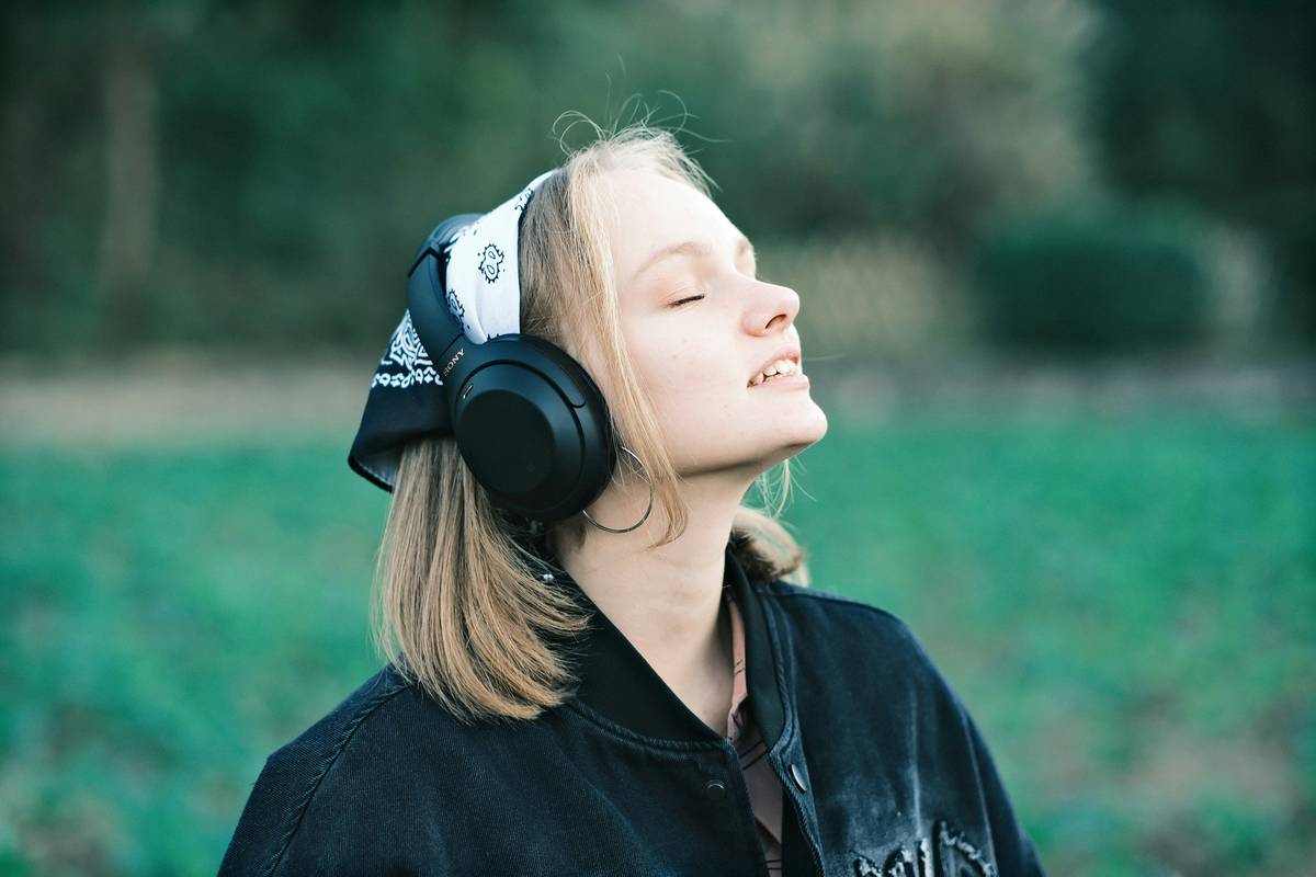 An image showcasing peaceful earbuds connected to a smartphone running a meditation app.